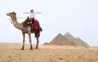  Giza Pyramids panoramic viewpoint at golden hour — sunset camel ride Cairo